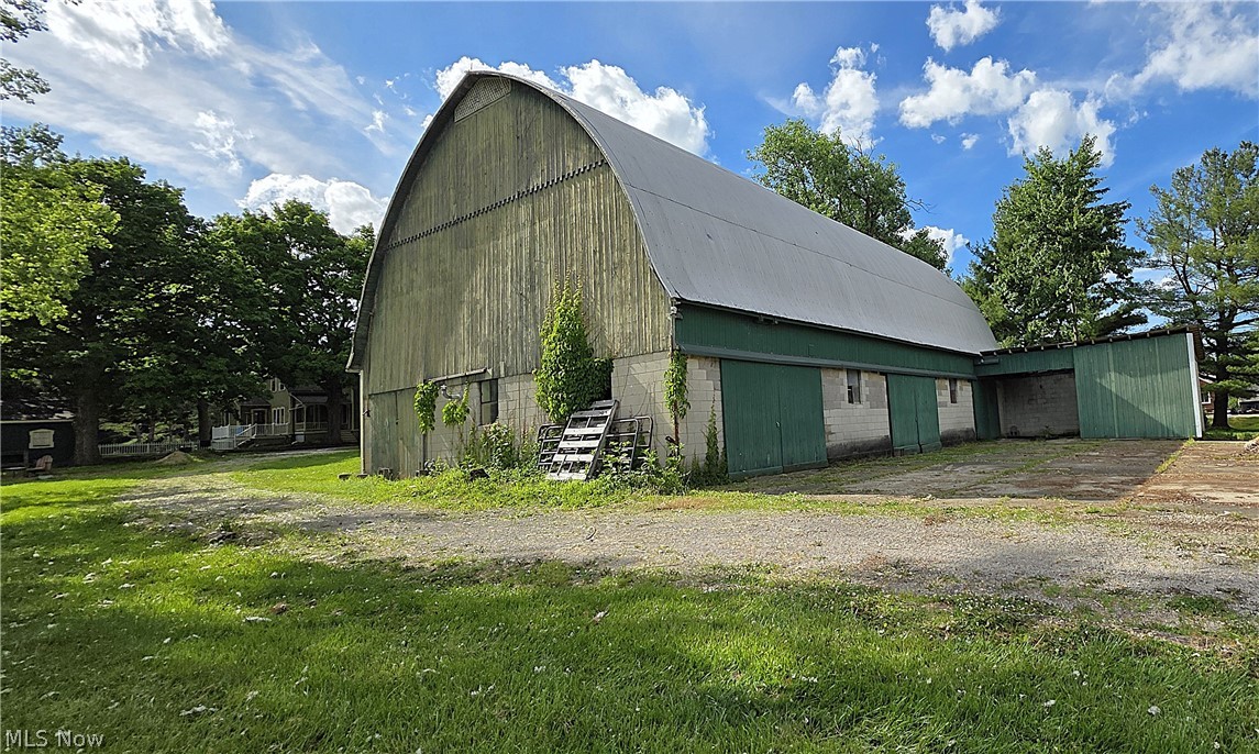 7414 Greenwich Road Seville, OH 44273 - Photo 45 of 50 Back & Side of Bank Barn. Lower barn level features multiple work areas, heat, and functional space for projects or equipment.