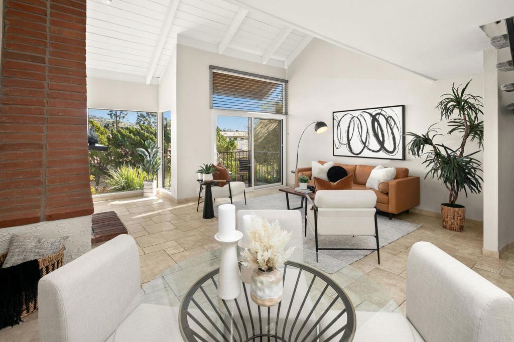 1939 Alga Road, Unit A Carlsbad, CA 92009 - Photo 4 of 32 a living room with furniture and a window