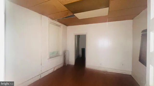 a bathroom with a glass door shower and a sink