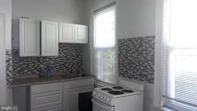 a bathroom with a toilet and a vanity