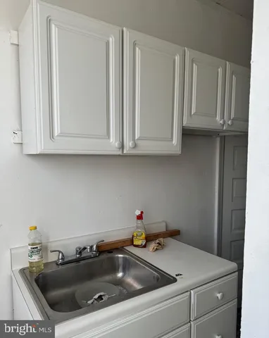 a bathroom with a sink toilet and mirror