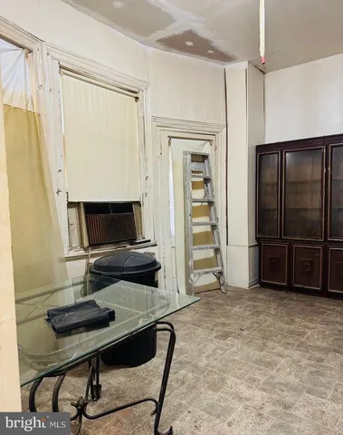 a room with window and furniture