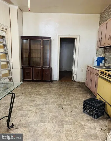 a view of a room with wooden floor and window