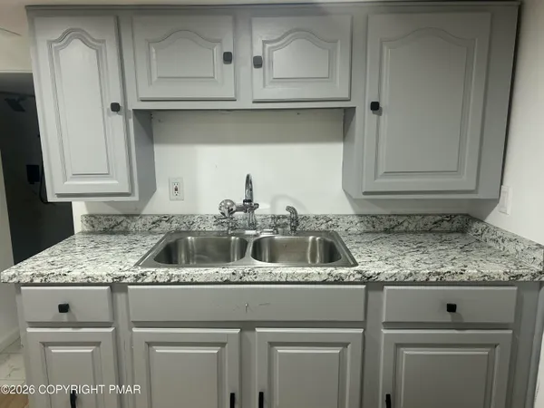 a view of kitchen with wooden floor