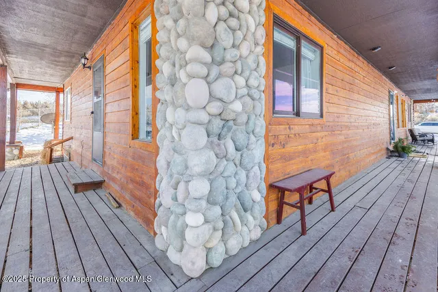 a bedroom with a bed and a mirror