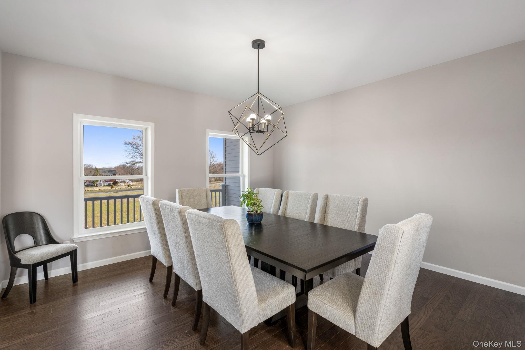 10 Harrier Ridge Drive Wallkill, NY 12589 - Photo 10 of 46 Dining room with dark wood-type flooring and a chandelier
