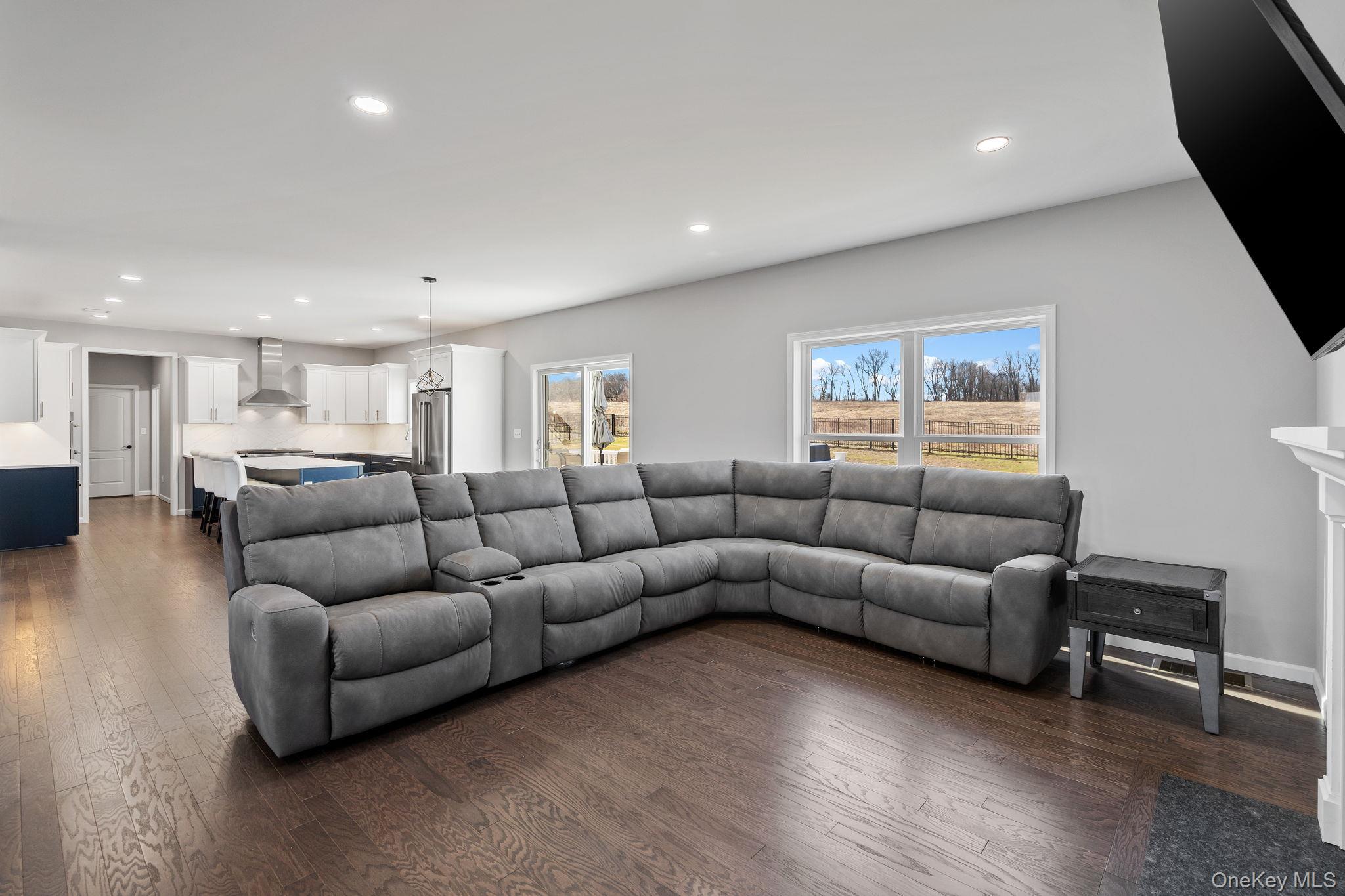 10 Harrier Ridge Drive Wallkill, NY 12589 - Photo 15 of 46 Living area with recessed lighting and dark wood-style floors