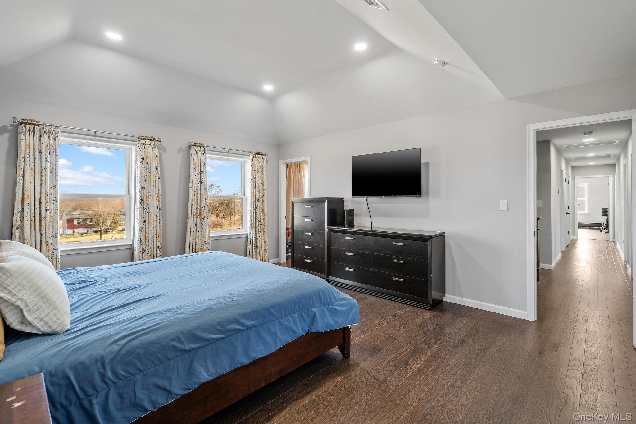 10 Harrier Ridge Drive Wallkill, NY 12589 - Photo 21 of 46 Bedroom with recessed lighting, dark wood-style floors, and lofted ceiling