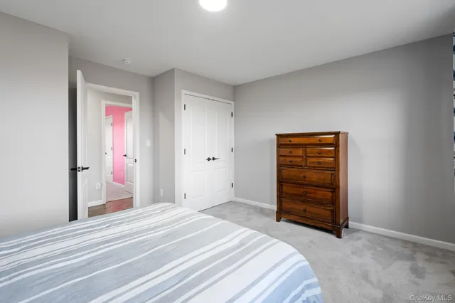 a bedroom with a bed and closet