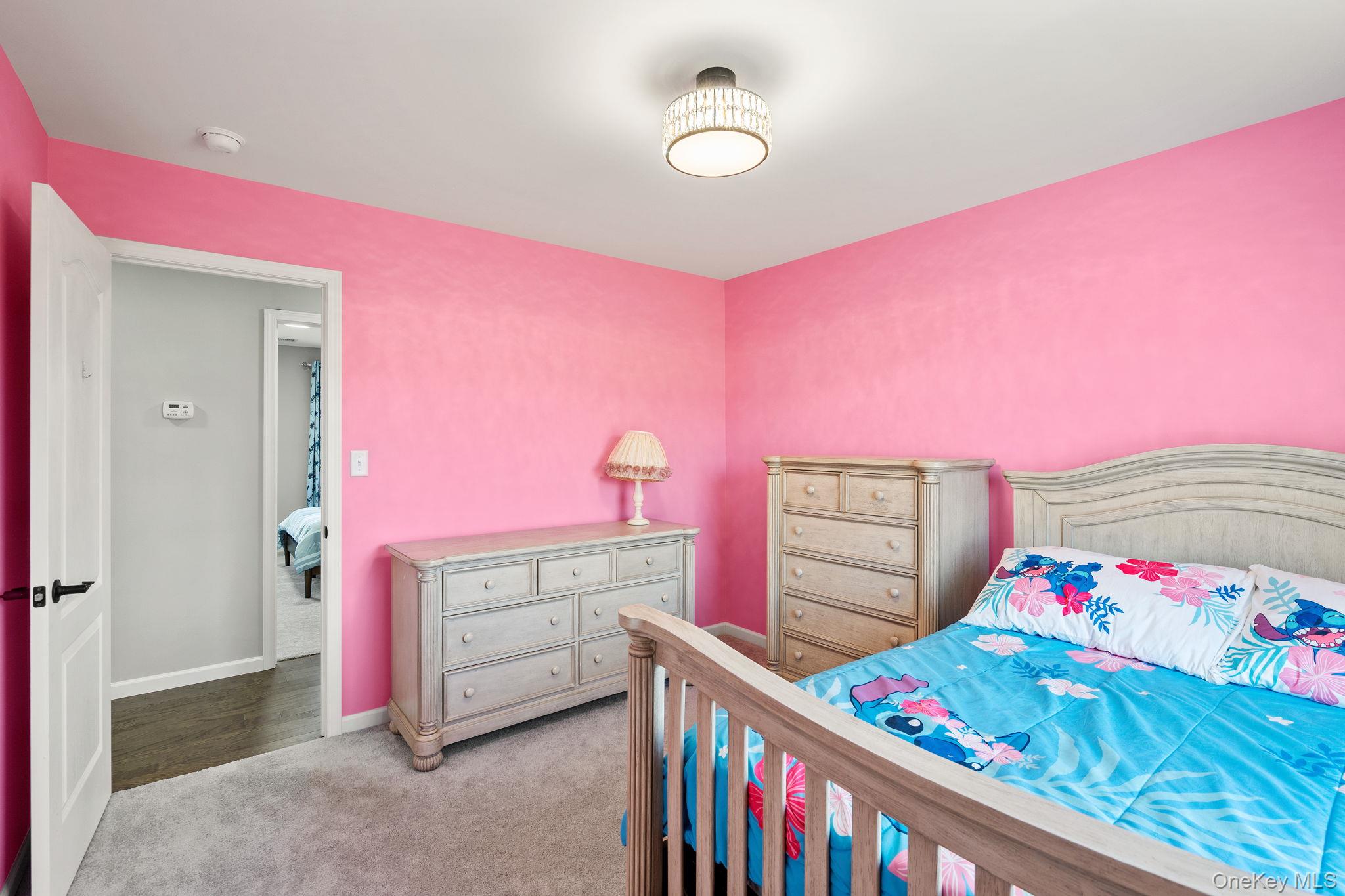 10 Harrier Ridge Drive Wallkill, NY 12589 - Photo 35 of 46 Bedroom with light carpet and baseboards