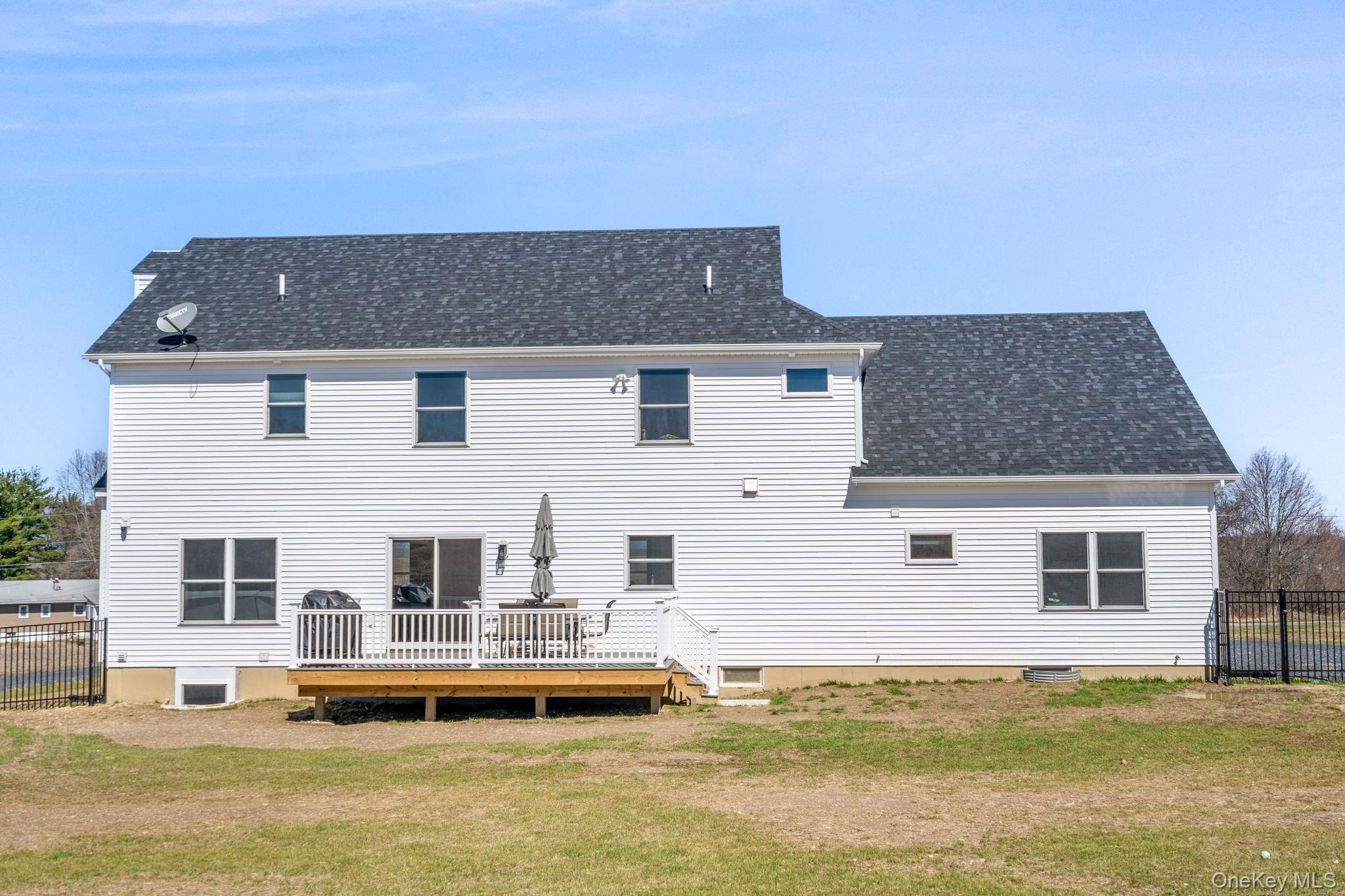 10 Harrier Ridge Drive Wallkill, NY 12589 - Photo 40 of 46 Back of property with a deck and roof with shingles
