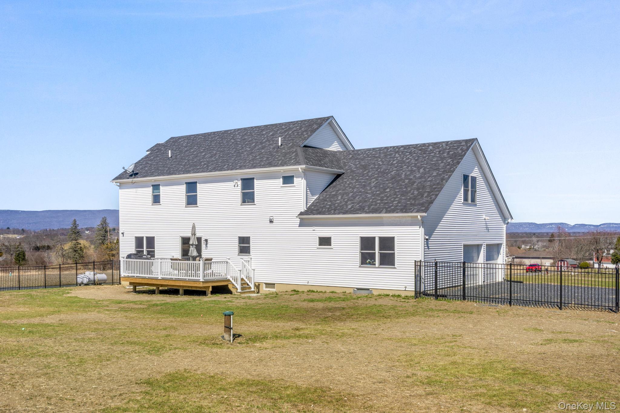 10 Harrier Ridge Drive Wallkill, NY 12589 - Photo 43 of 46 Rear view of property with a deck with mountain view and a shingled roof