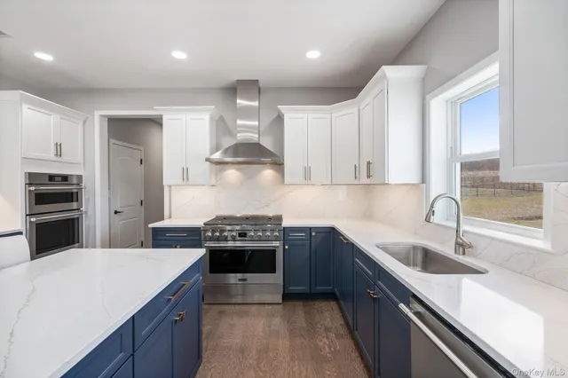 a large kitchen with a table and chairs