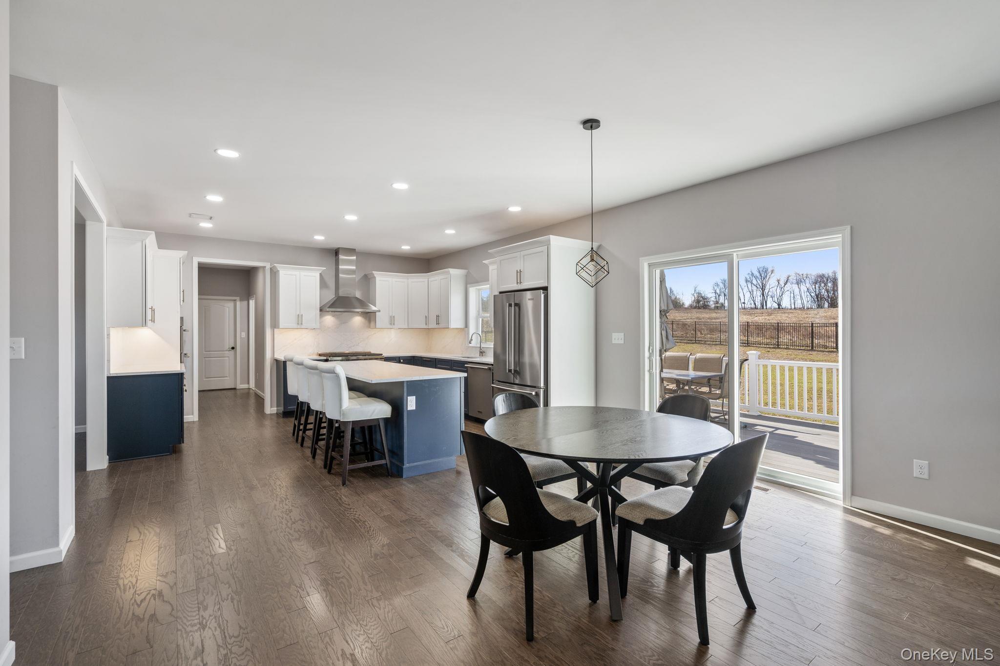 10 Harrier Ridge Drive Wallkill, NY 12589 - Photo 7 of 46 Dining space with recessed lighting and dark wood-style floors
