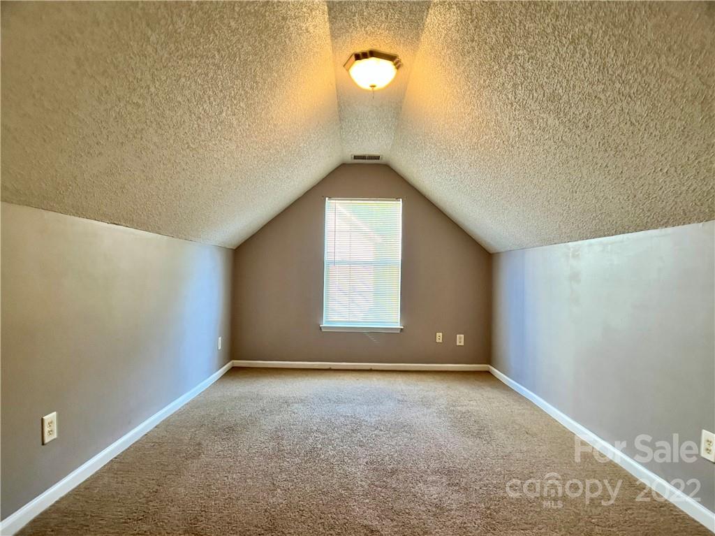 2005 Pimpernel Road Charlotte, NC 28213 - Photo 18 of 24 an empty room with a empty space and windows