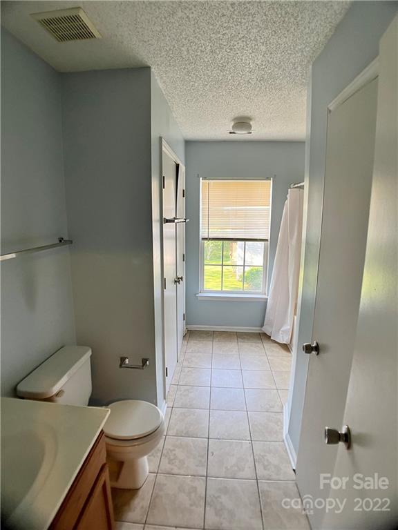 2005 Pimpernel Road Charlotte, NC 28213 - Photo 21 of 24 a bathroom with a toilet