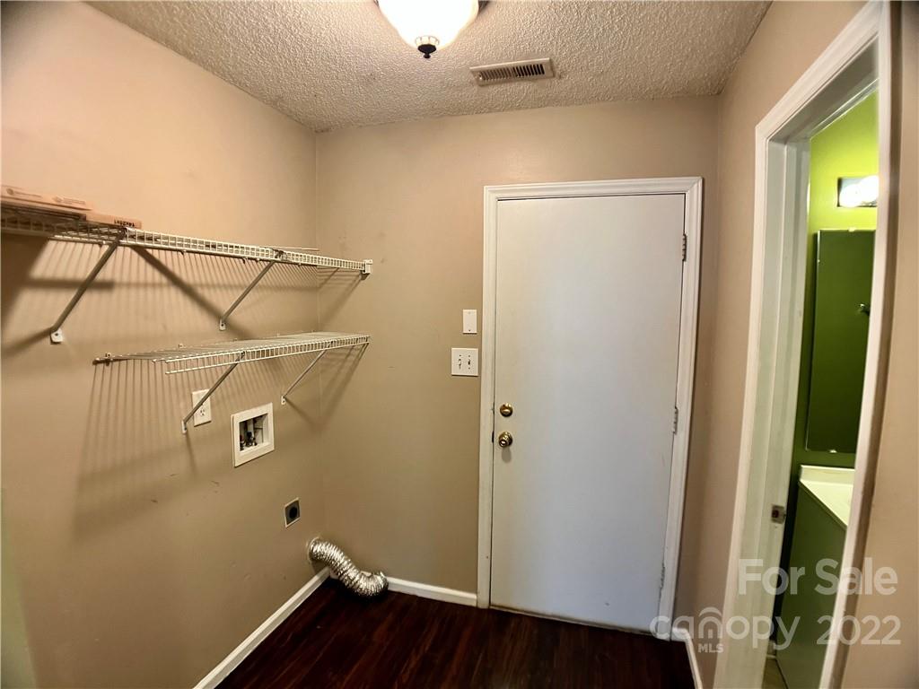 2005 Pimpernel Road Charlotte, NC 28213 - Photo 23 of 24 a view of a room with wooden floor and windows