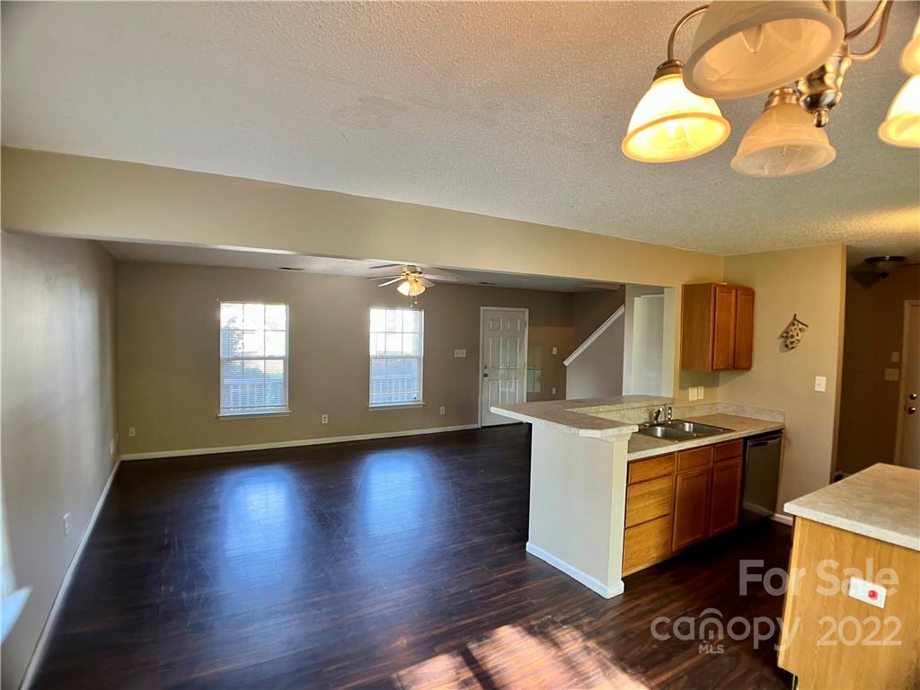 2005 Pimpernel Road Charlotte, NC 28213 - Photo 8 of 24 a kitchen with a stove and wooden floor