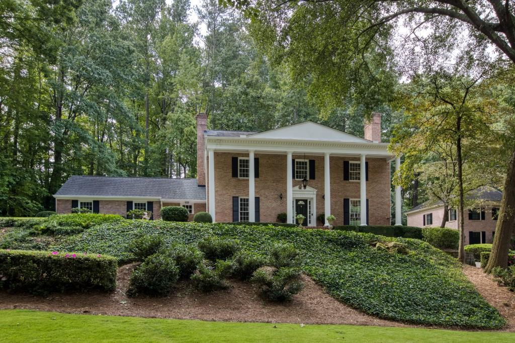 7185 Riverside Drive Sandy Springs, GA 30328 - Photo 1 of 1 a front view of a house with a yard