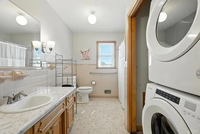 a bathroom with a double vanity sink a mirror and shower