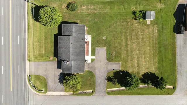 an aerial view of a house with a garden