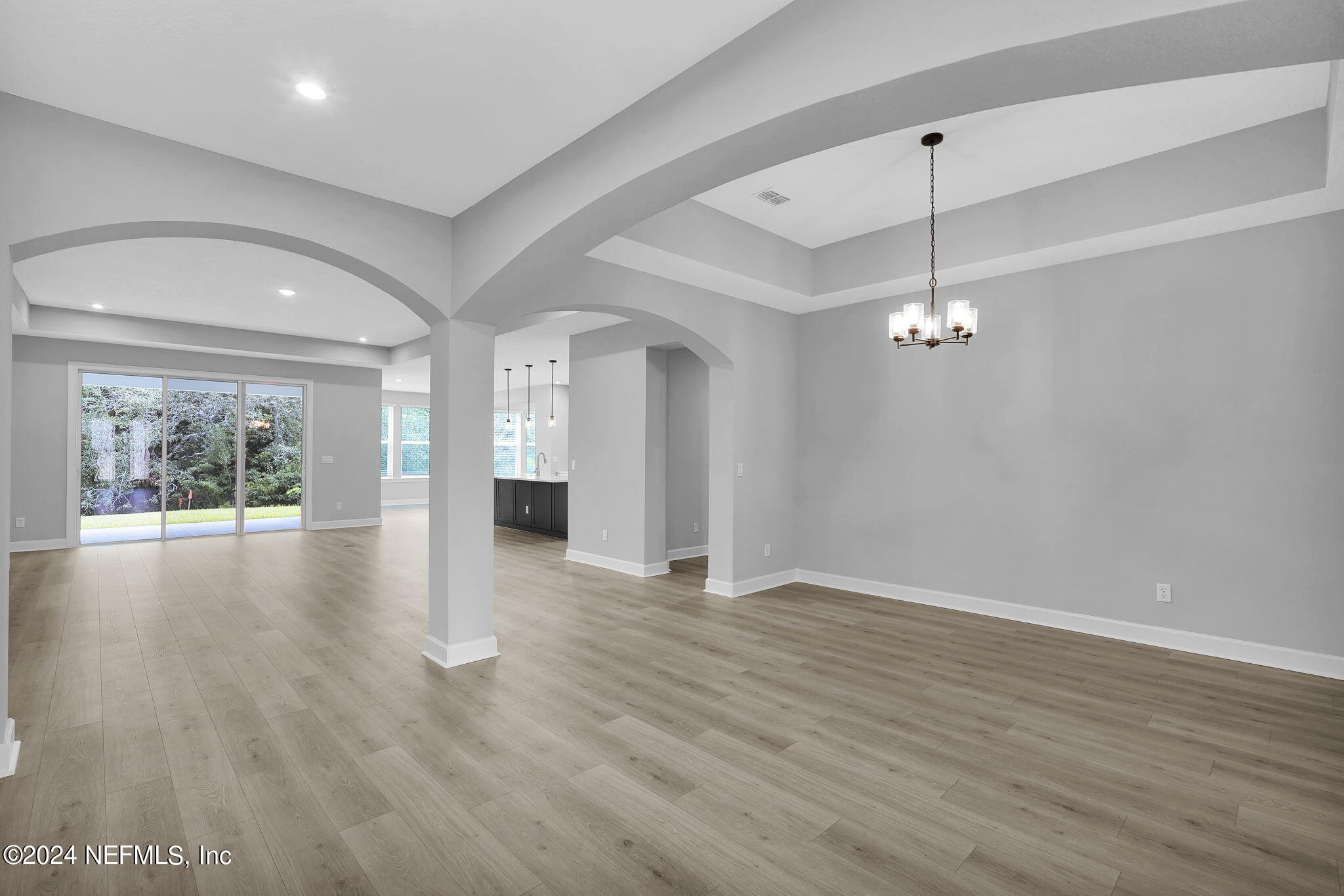 116 Greylock Lane St. Augustine, FL 32092 - Photo 14 of 50 an empty room with wooden floor and windows
