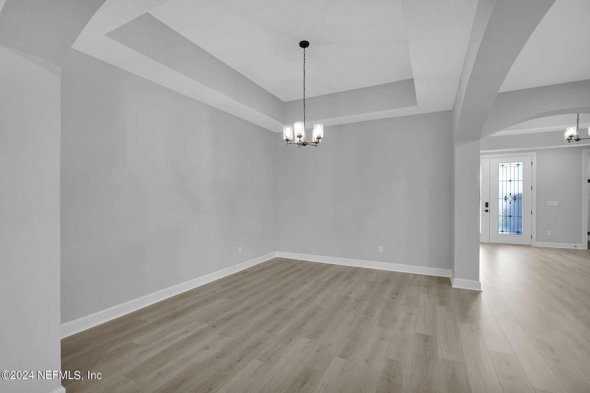 116 Greylock Lane St. Augustine, FL 32092 - Photo 16 of 50 a view of a room with wooden floor and chandelier