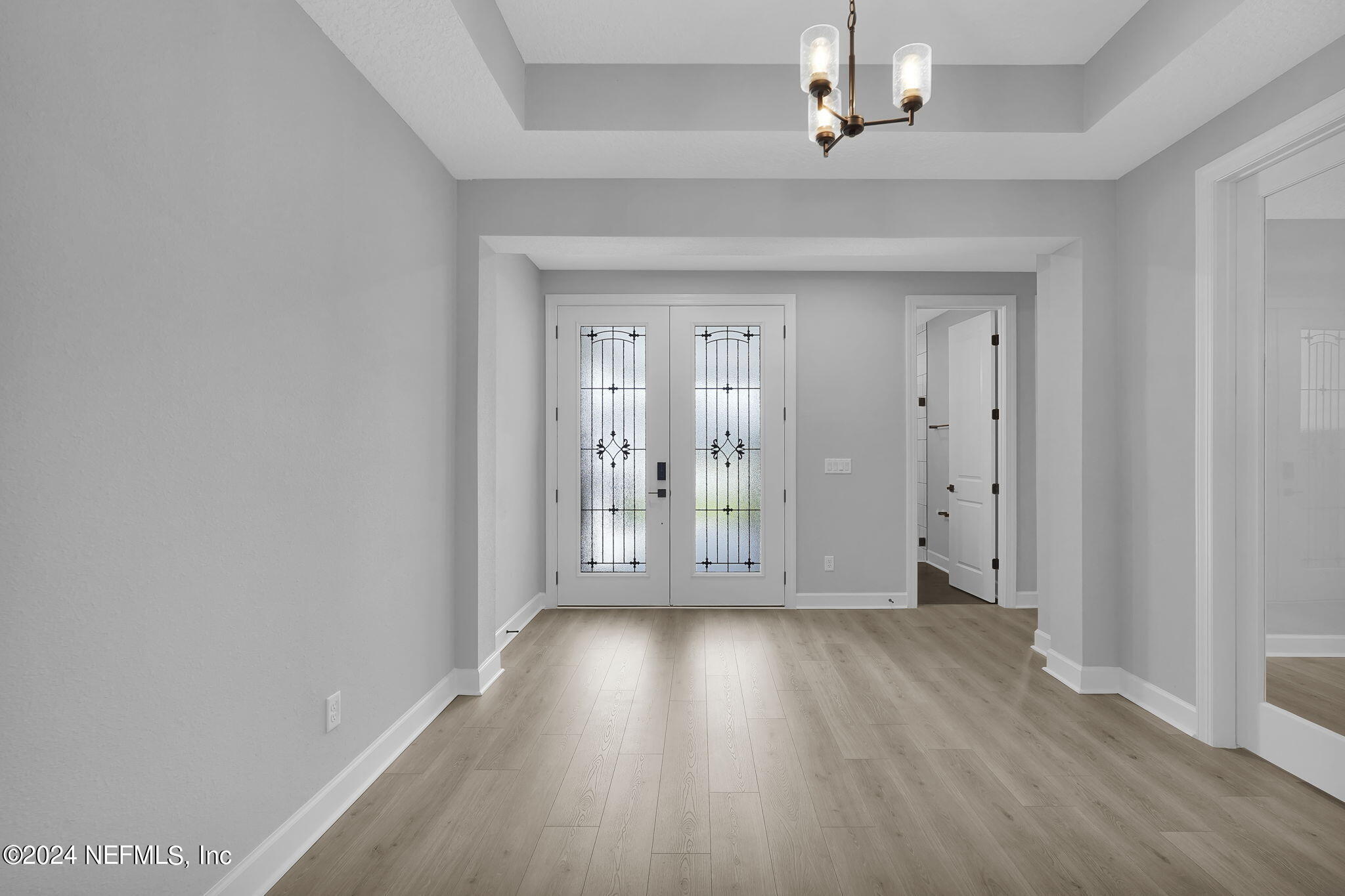 116 Greylock Lane St. Augustine, FL 32092 - Photo 19 of 50 wooden floor in an empty room with a window