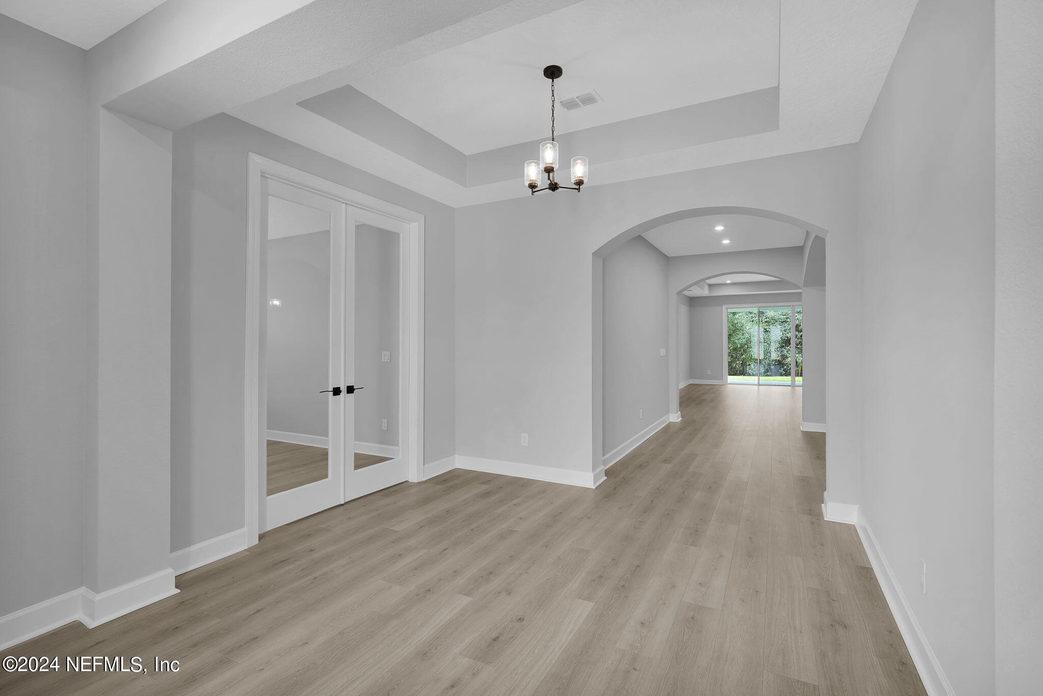 116 Greylock Lane St. Augustine, FL 32092 - Photo 20 of 50 wooden floor in an empty room with a window