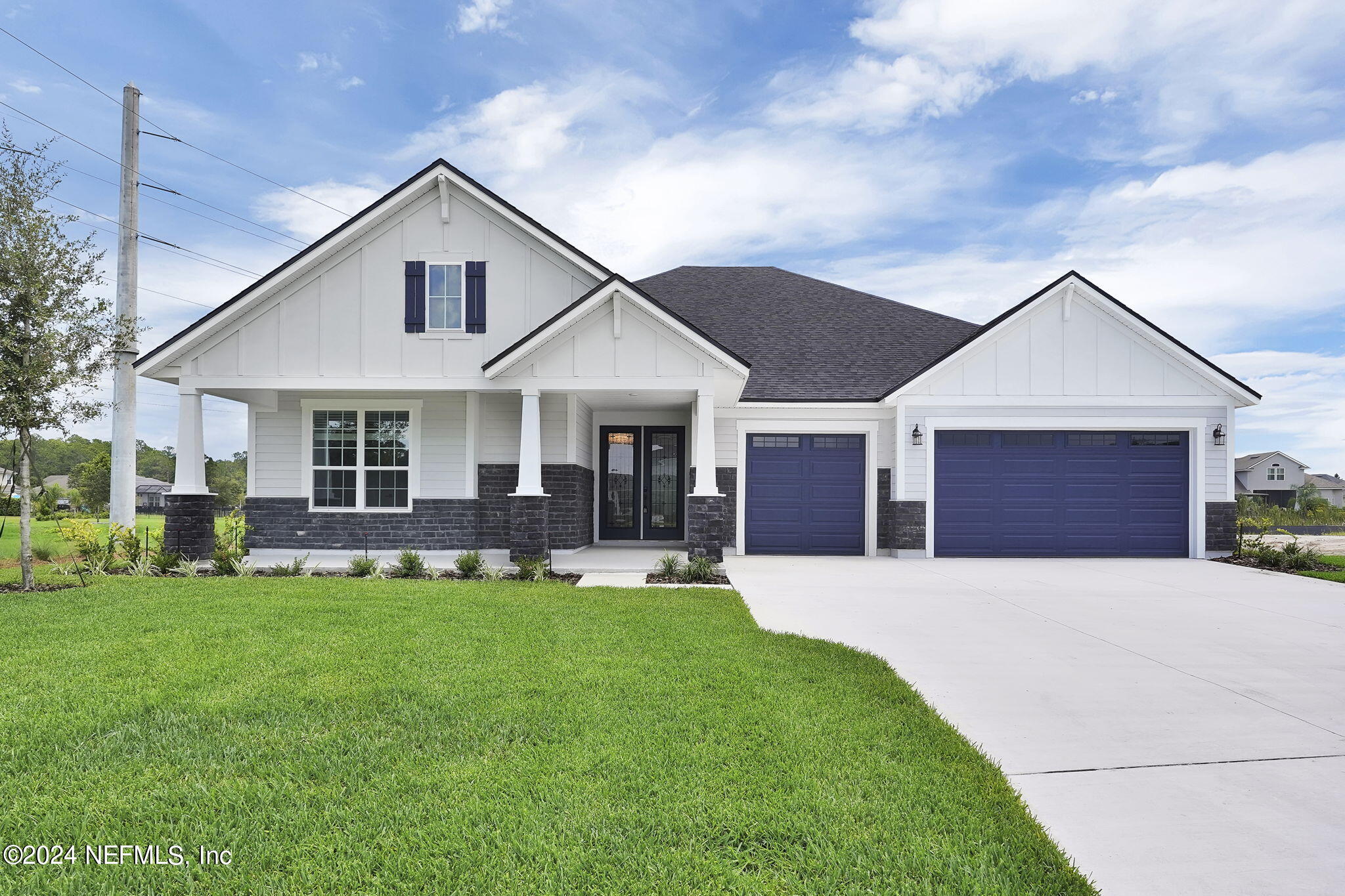 116 Greylock Lane St. Augustine, FL 32092 - Photo 21 of 50 a front view of a house with a yard and patio