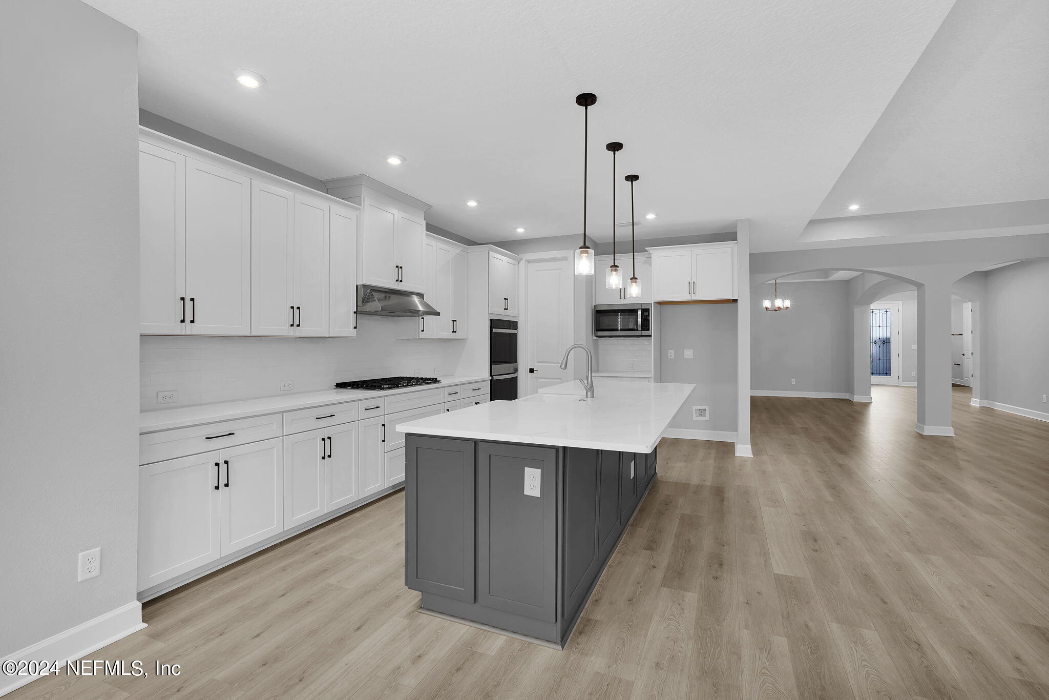 116 Greylock Lane St. Augustine, FL 32092 - Photo 26 of 50 a large kitchen with stainless steel appliances kitchen island a large island in the center