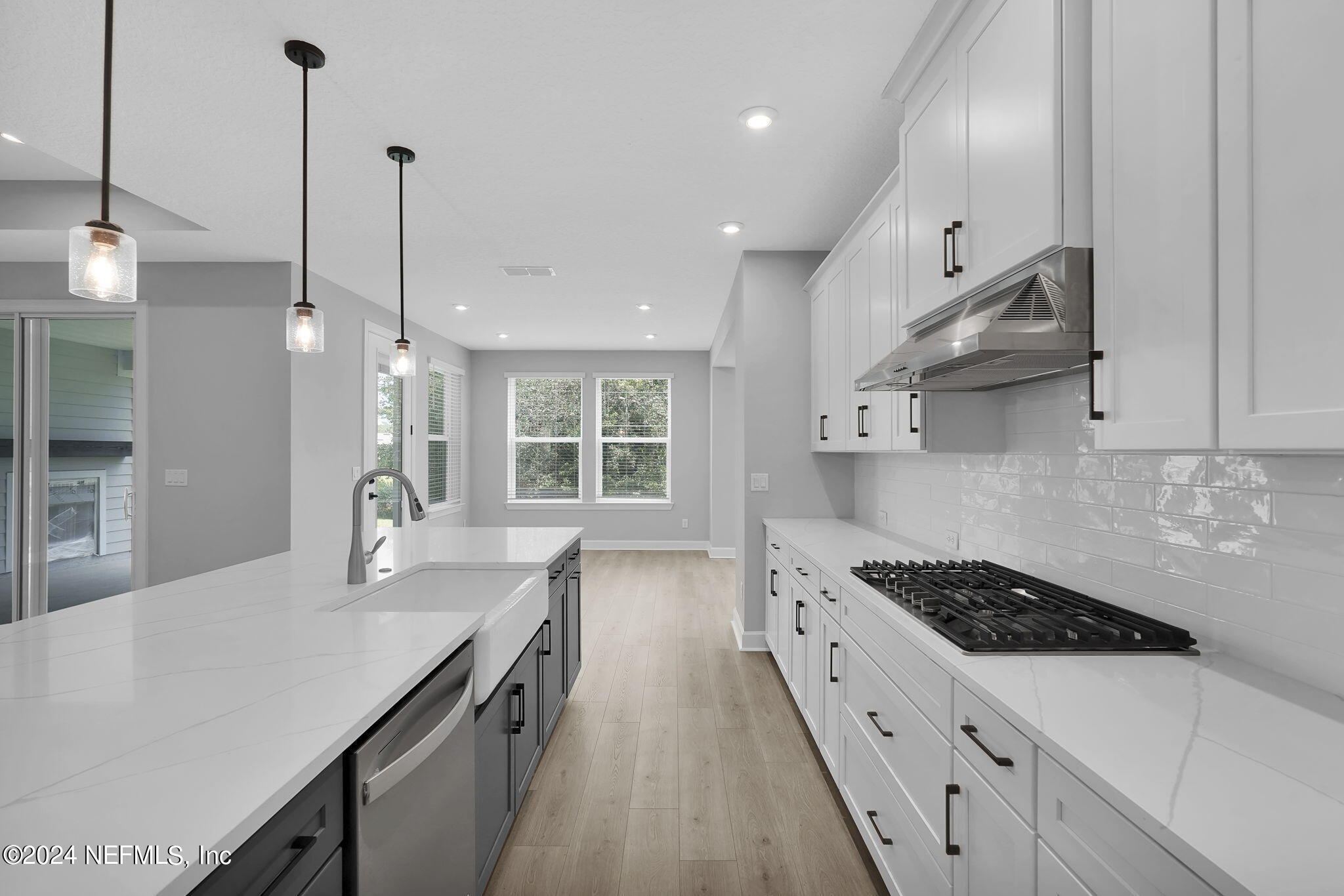 116 Greylock Lane St. Augustine, FL 32092 - Photo 28 of 50 a kitchen with stainless steel appliances sink stove and cabinets