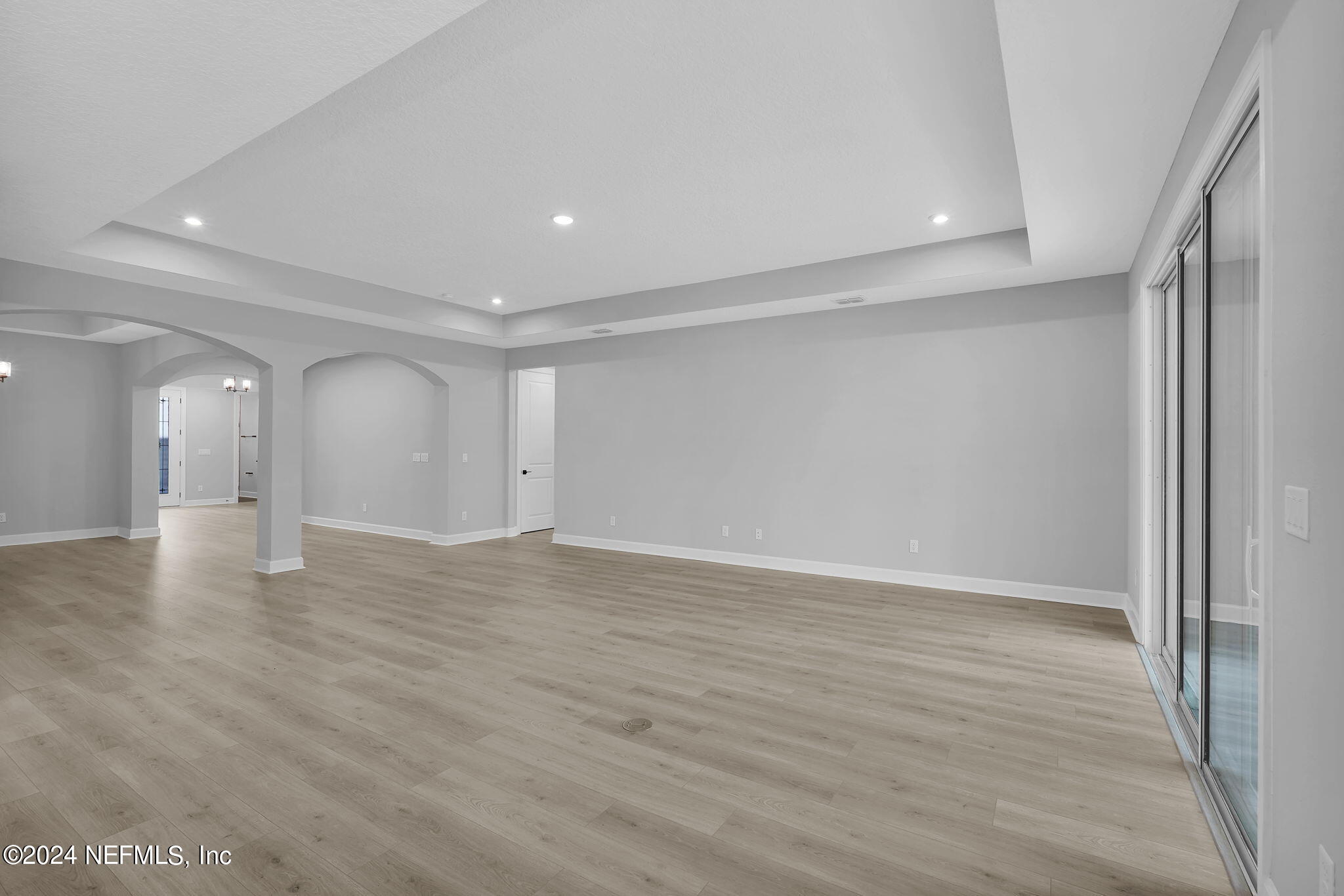 116 Greylock Lane St. Augustine, FL 32092 - Photo 36 of 50 wooden floor in an empty room with a window
