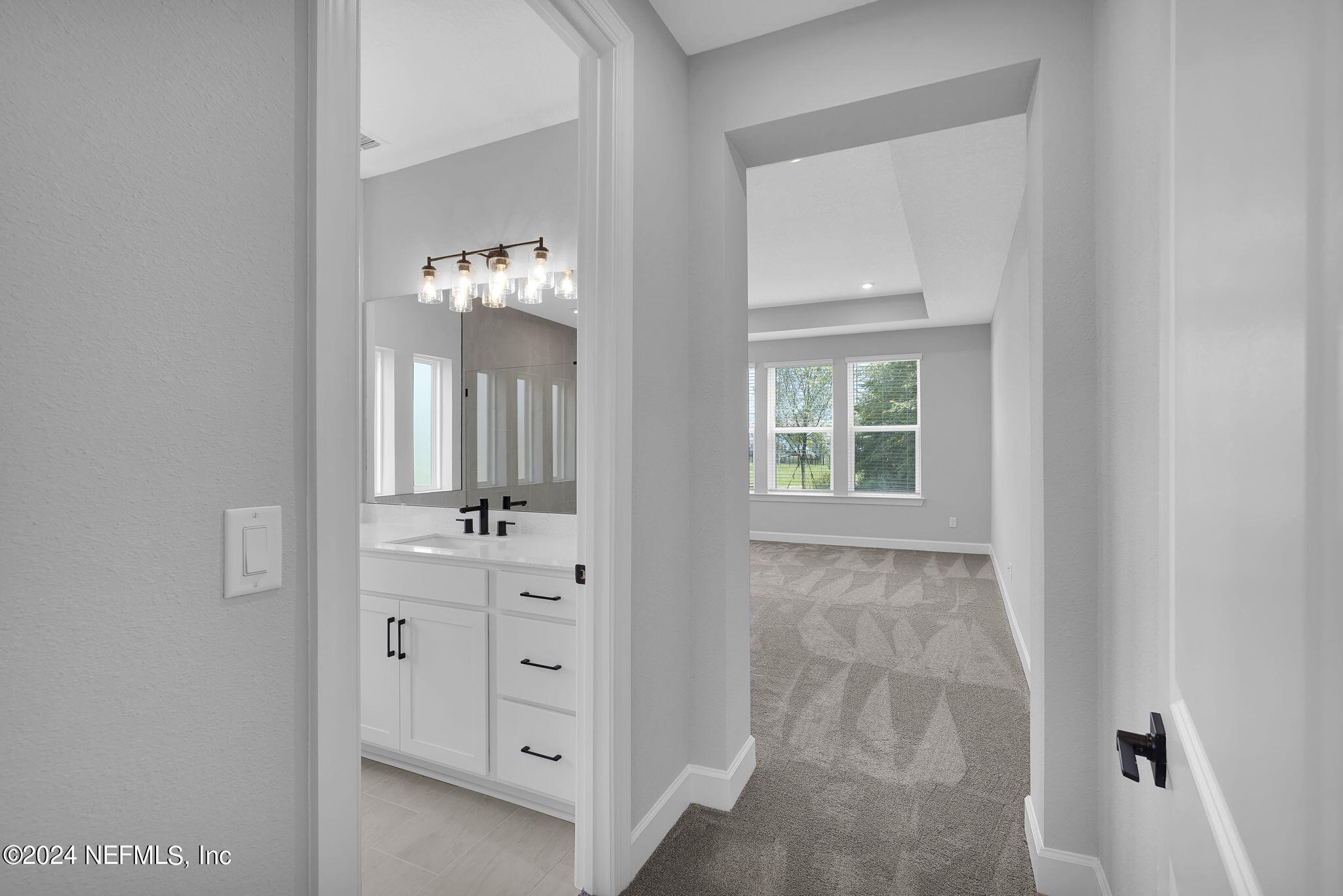 116 Greylock Lane St. Augustine, FL 32092 - Photo 37 of 50 view of a bathroom with mirror and window