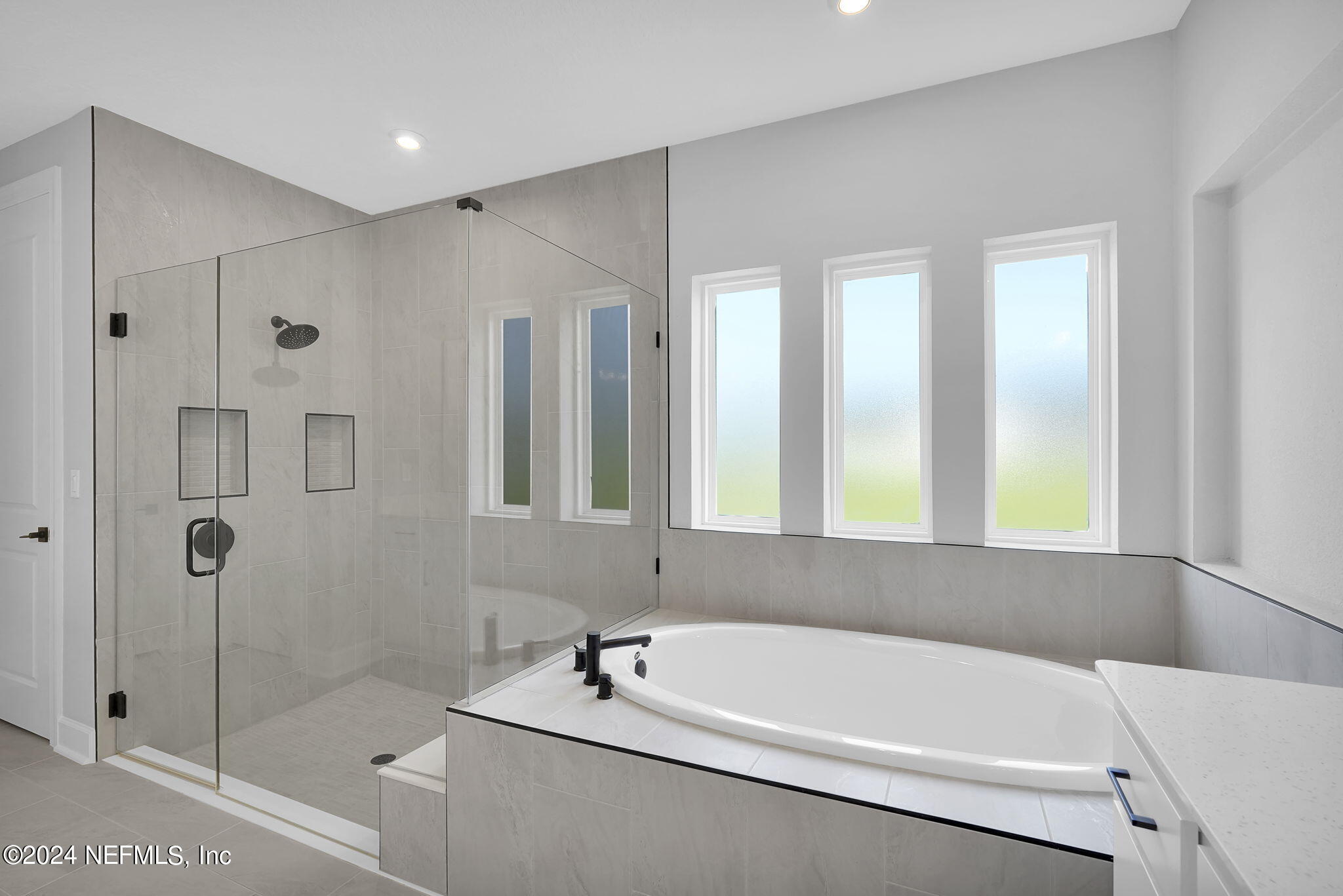 116 Greylock Lane St. Augustine, FL 32092 - Photo 39 of 50 a white bath tub sitting next to a shower