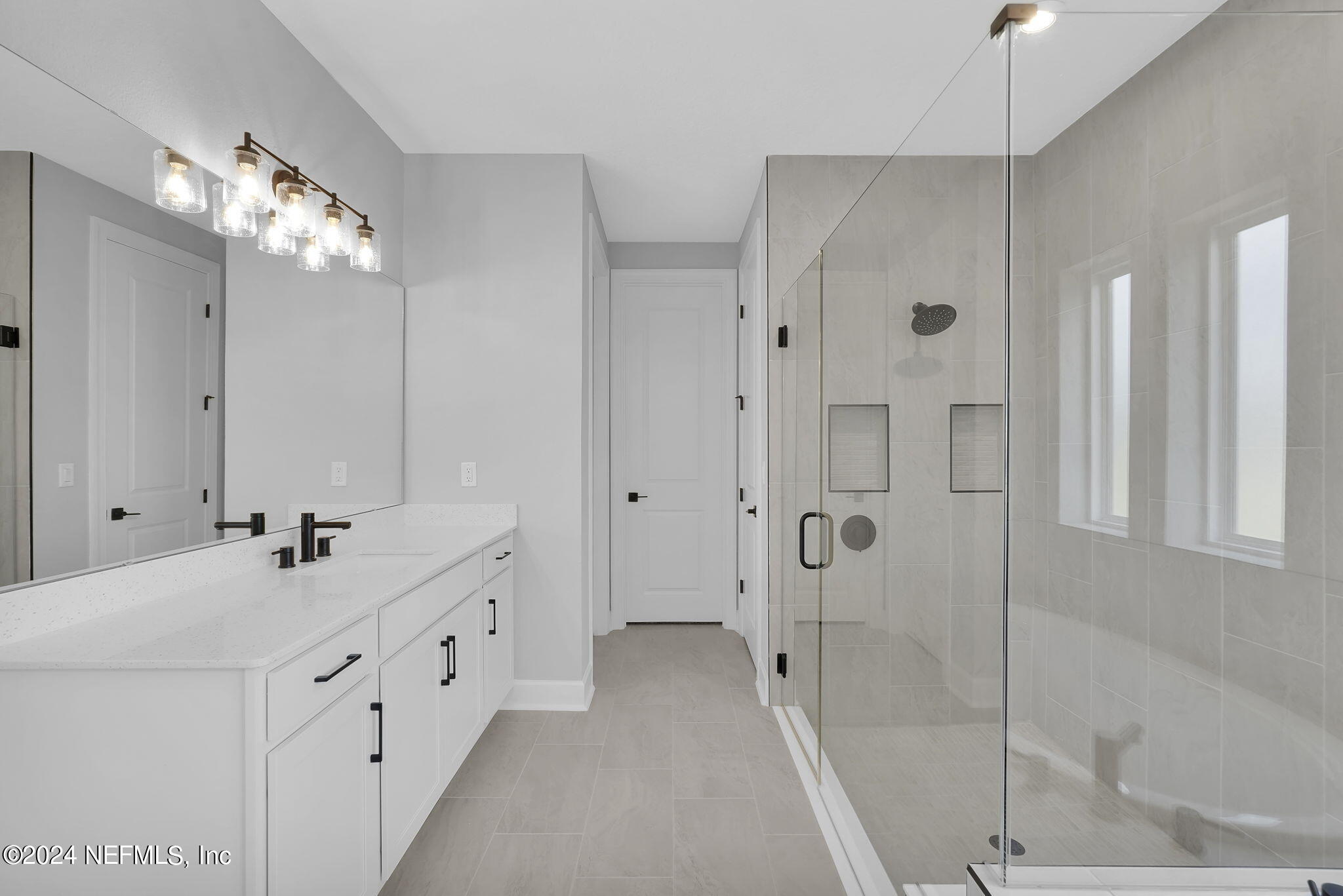 116 Greylock Lane St. Augustine, FL 32092 - Photo 40 of 50 a spacious bathroom with double vanity and a shower