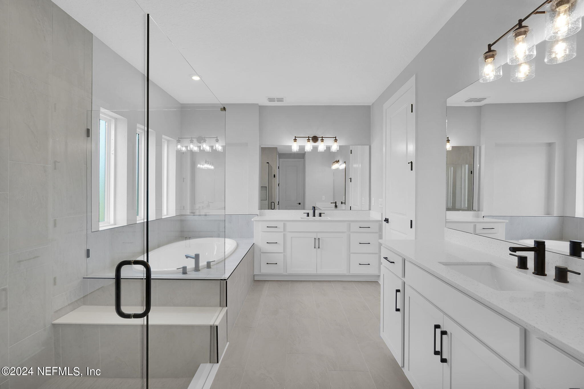 116 Greylock Lane St. Augustine, FL 32092 - Photo 41 of 50 a bathroom with a double vanity sink a toilet a mirror and shower