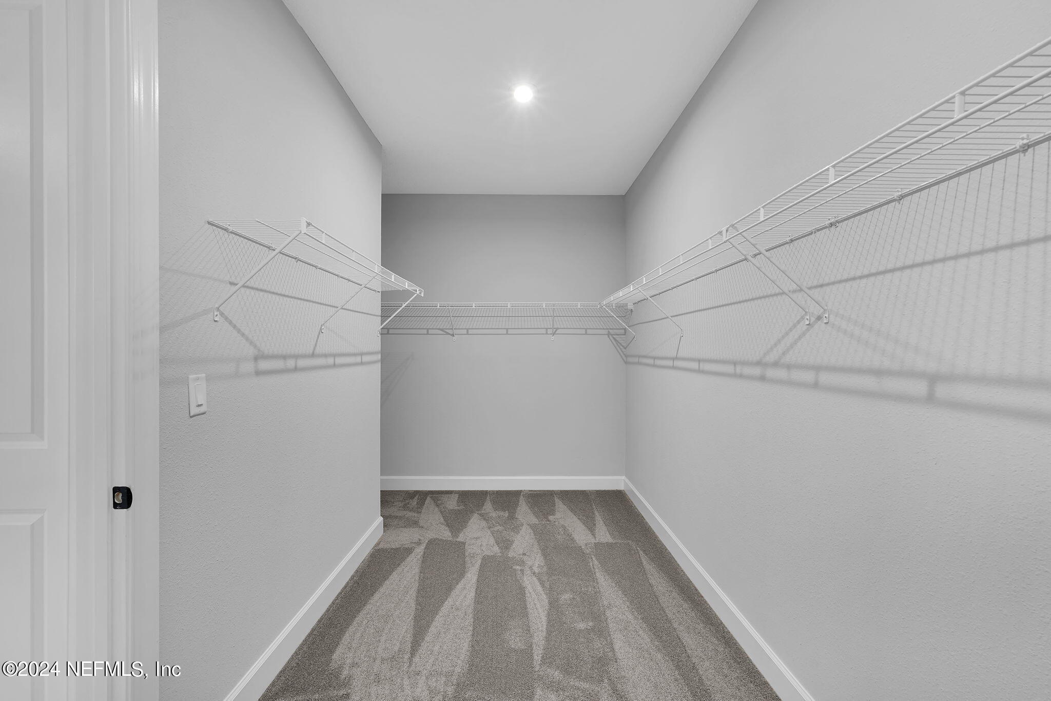 116 Greylock Lane St. Augustine, FL 32092 - Photo 42 of 50 a view of a room with racks on the wall