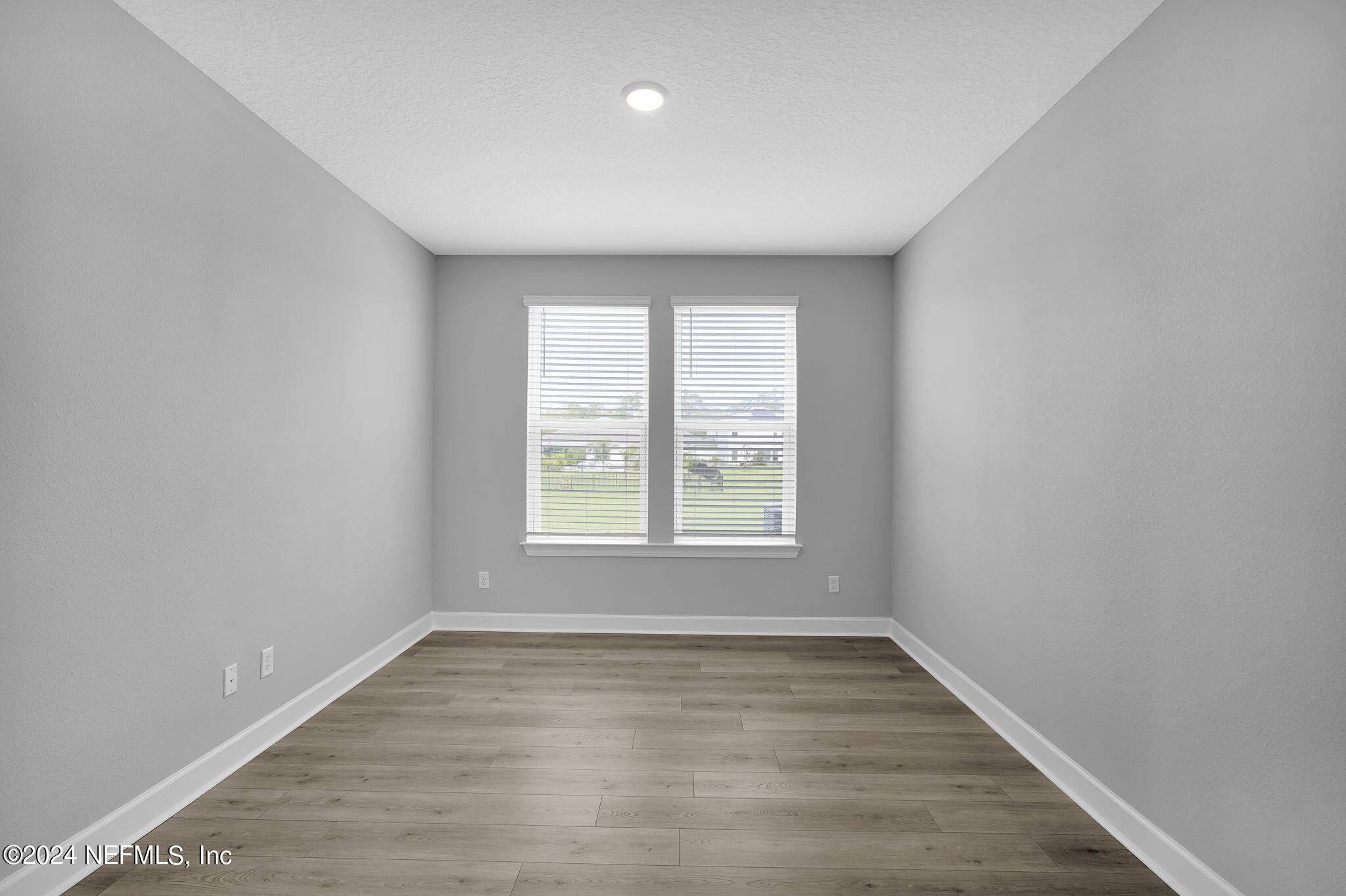116 Greylock Lane St. Augustine, FL 32092 - Photo 45 of 50 an empty room with wooden floor and windows