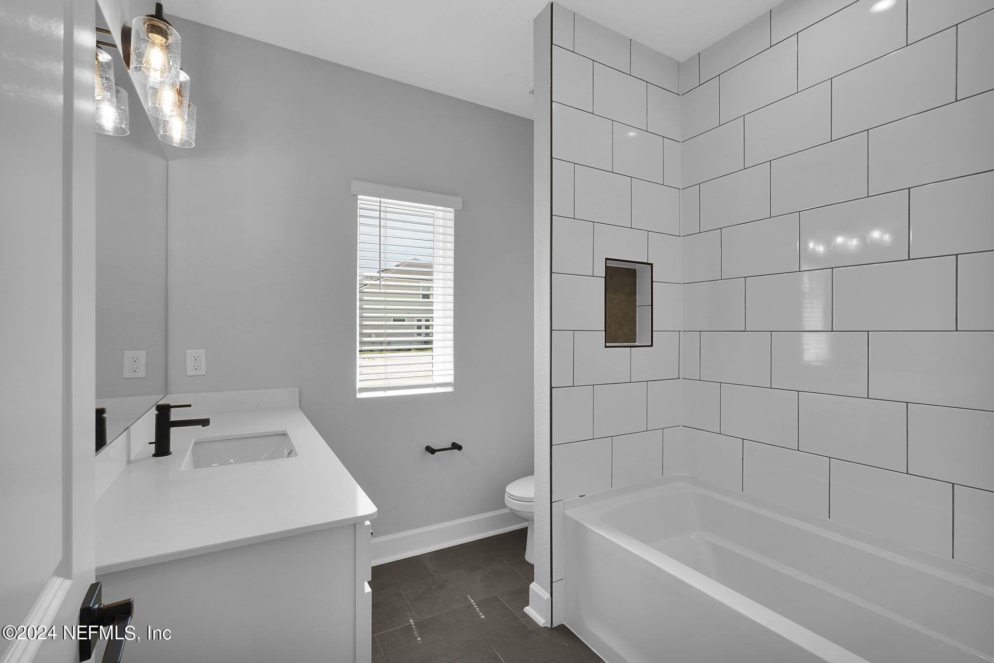 116 Greylock Lane St. Augustine, FL 32092 - Photo 9 of 50 a white bath tub sitting next to a white sink