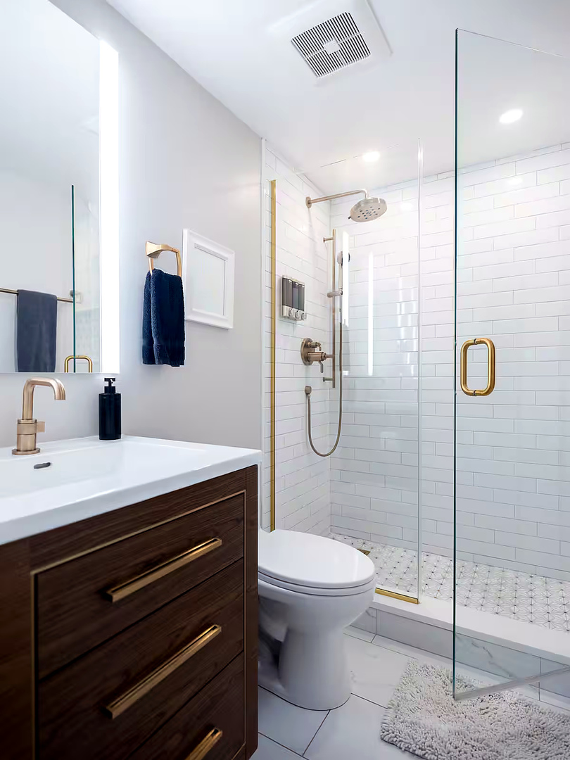 1427 North Mohawk Street Chicago, IL 60610 - Photo 12 of 54 a bathroom with a sink a toilet a mirror and shower