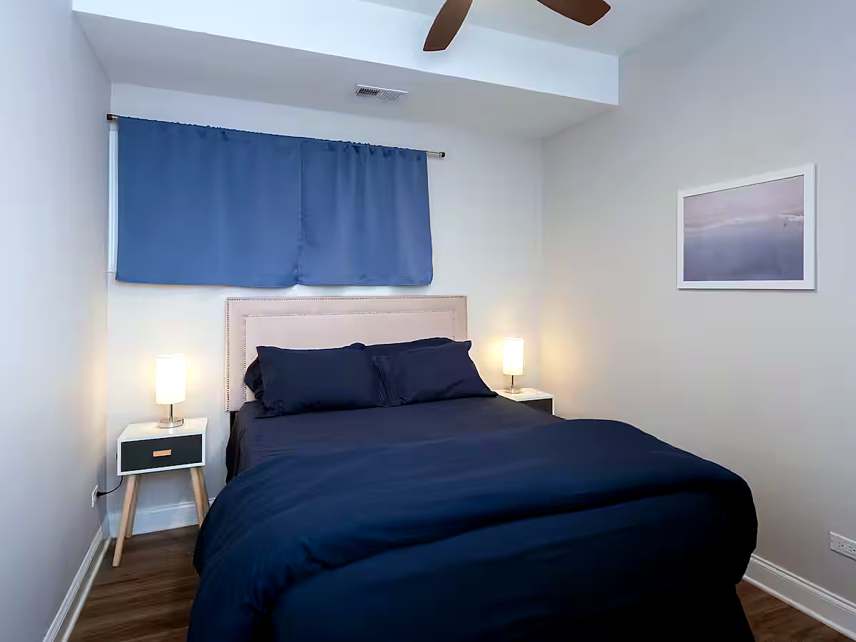 1427 North Mohawk Street Chicago, IL 60610 - Photo 17 of 54 a bedroom with a bed and wooden floor