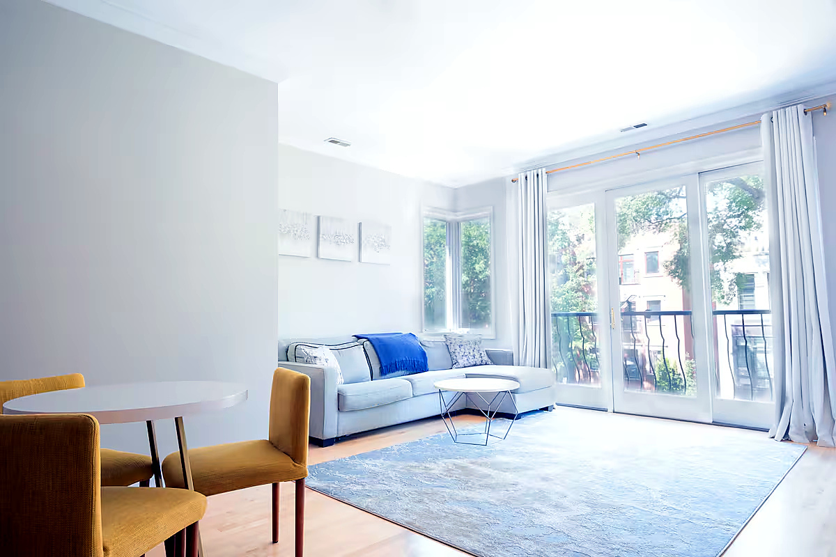 1427 North Mohawk Street Chicago, IL 60610 - Photo 42 of 54 a living room with furniture and a large window