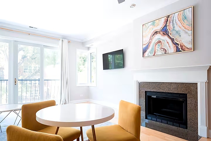 1427 North Mohawk Street Chicago, IL 60610 - Photo 43 of 54 a living room with furniture a flat screen tv and a fireplace
