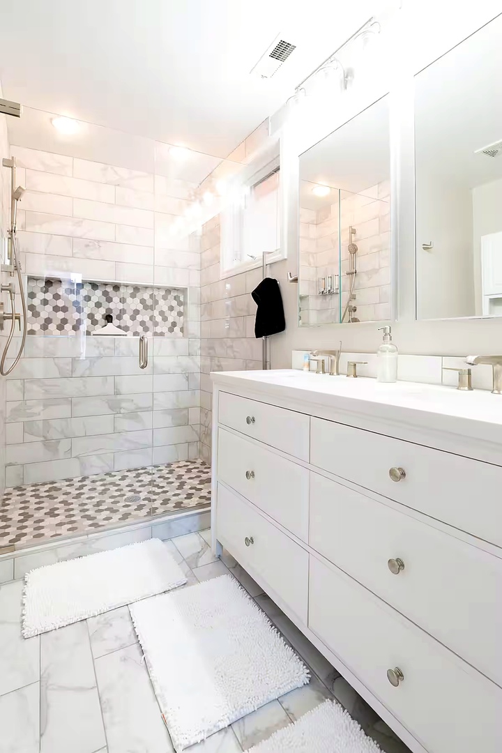1427 North Mohawk Street Chicago, IL 60610 - Photo 51 of 54 a bathroom with a double vanity sink mirror and shower