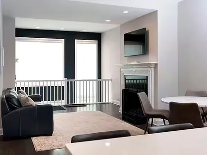 a bedroom with a bed and painting on the wall