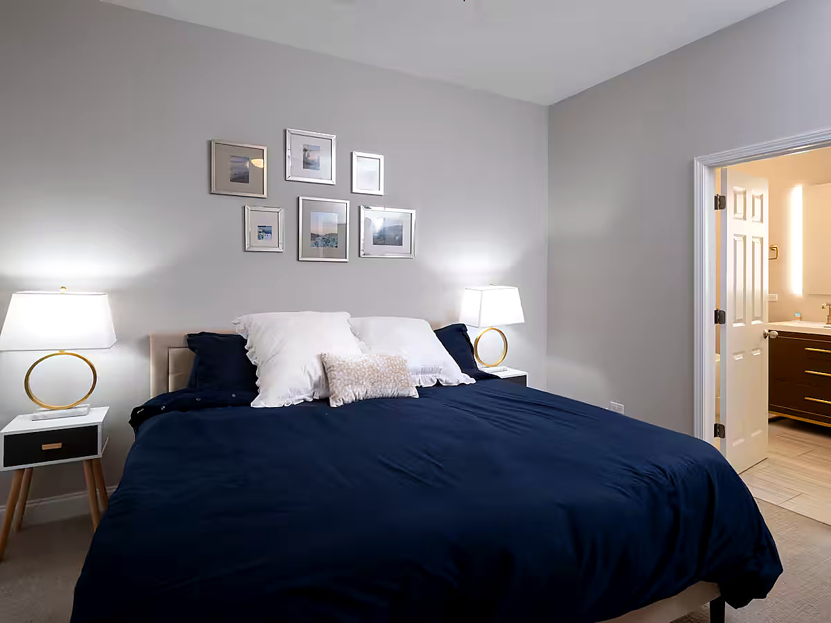 1427 North Mohawk Street Chicago, IL 60610 - Photo 8 of 54 a bedroom with a bed and painting on the wall