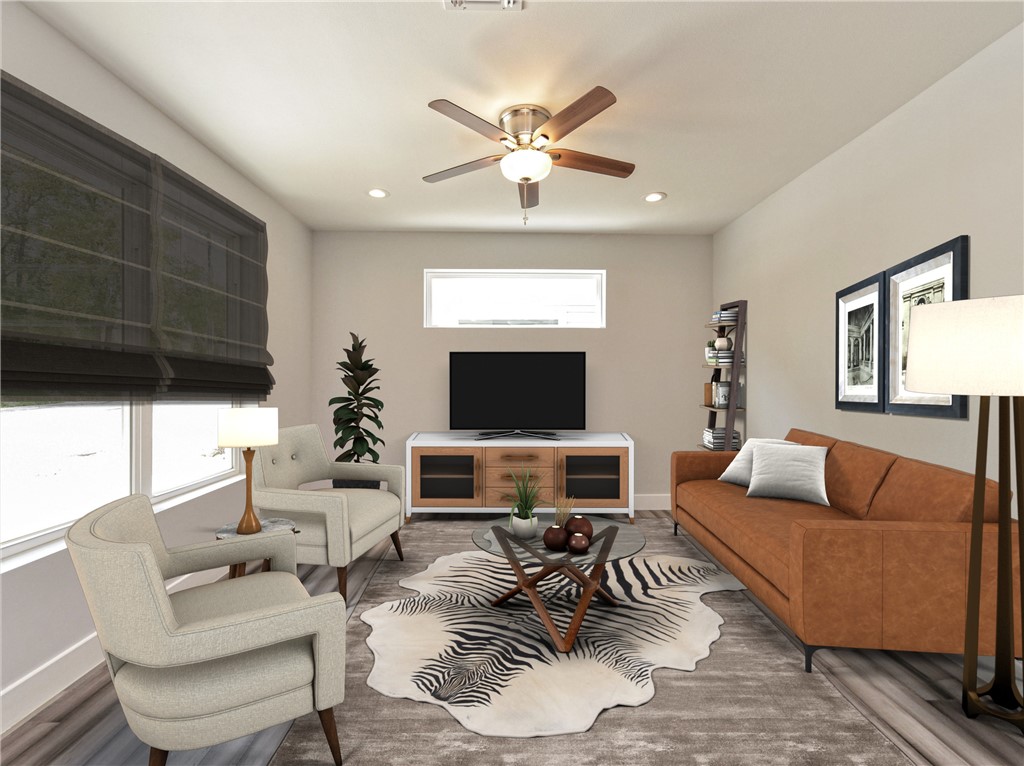 6109 Cherrylawn Circle, Unit B Austin, TX 78723 - Photo 1 of 1 a living room with furniture and a fireplace