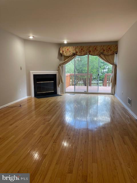 93 Castleton Road Princeton, NJ 08540 - Photo 5 of 25 a view of empty room with wooden floor and fan