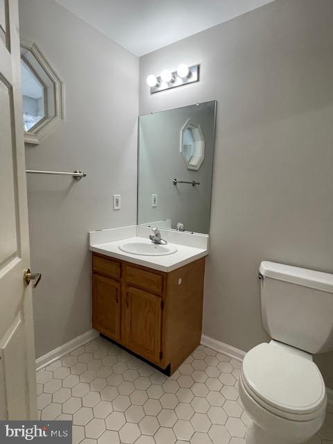 93 Castleton Road Princeton, NJ 08540 - Photo 8 of 25 a bathroom with a toilet sink and mirror